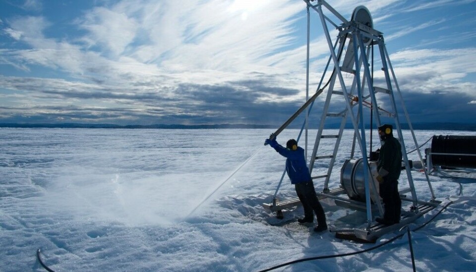 Testing the hot-water drill next to the drill tower. Photo: Henry Patton