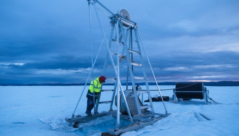 Alun Hubbard monitors the borehole drilling during the night shift. Photo: Henry Patton