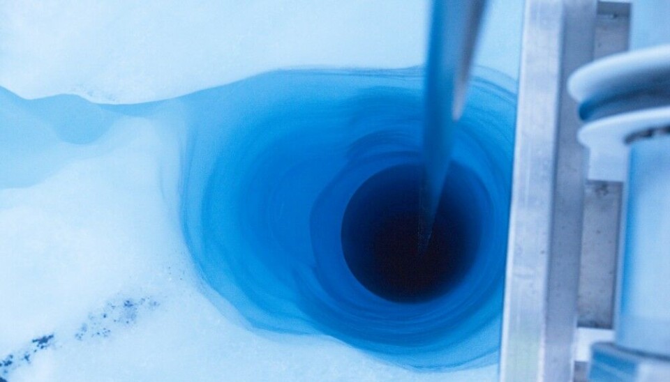 The connection to the glacier bed is made, draining water out from the bottom of the borehole. Photo: Henry Patton