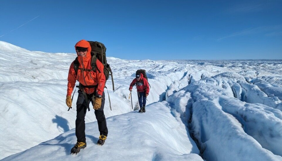 Petra Klímová and Alun Hubbard with loaded packs of fuel, on the return trip to camp. Photo Henry Patton