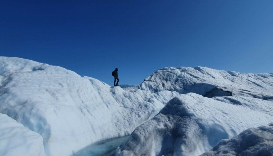 Henry Patton searches for a route through the complex glacial terrain. Photo: Alun Hubbard