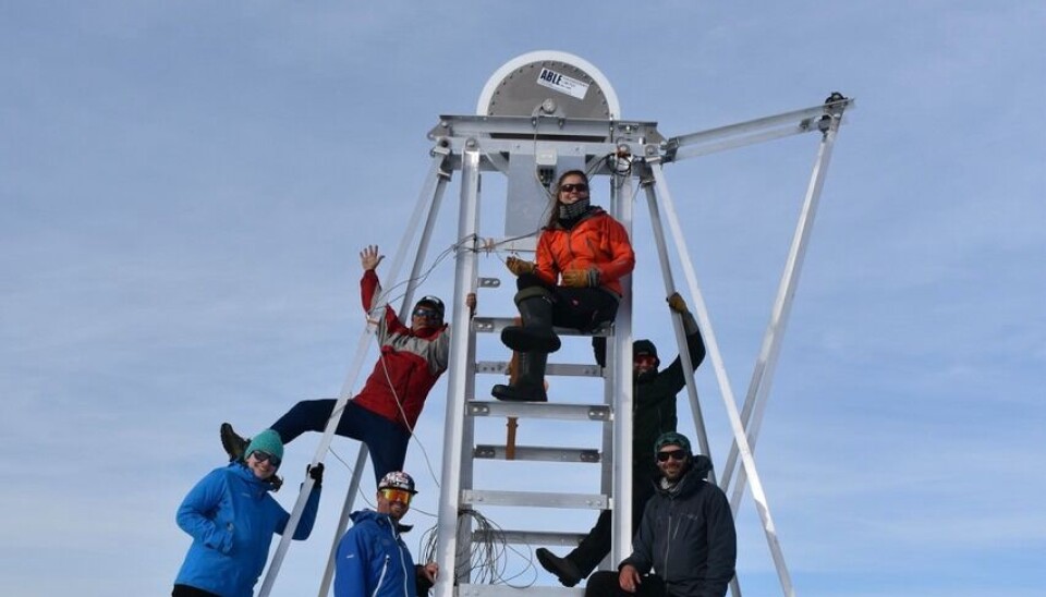 The science team pose for a group photo on the drill tower. L-R: Lia Wentzel, Alun Hubbard, Hayden Pearson, Petra Klímová, David Hildes, Henry Patton.