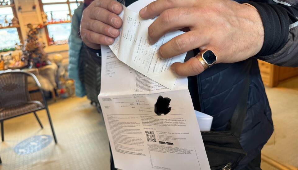 Vitek from Murmansk holding his stamped receipts in the tax-free shop in Kirkenes. Photo: Elizaveta Vereykina