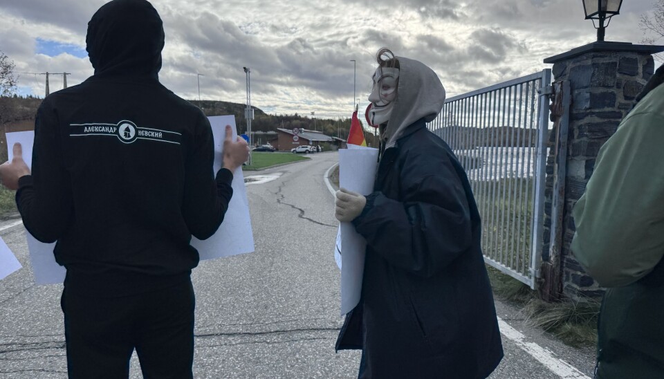 Activists face the border during the border event.