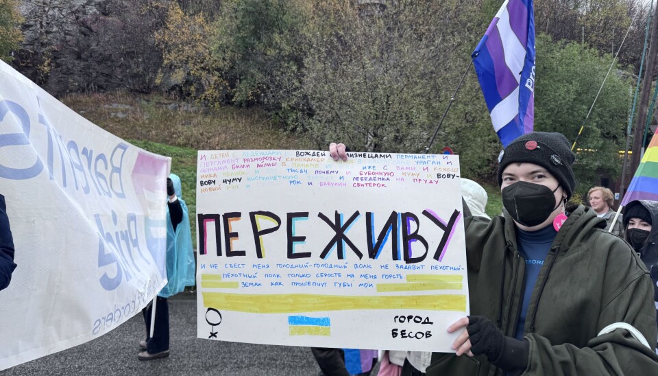 The activist's poster features lyrics of Monetochka, a popular Russian singer