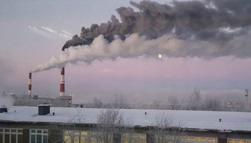Threatening black smoke from the Murmansk Thermal Heating Plant No1 over city.