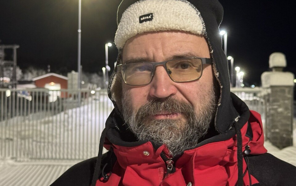Sergei Filenko waits for the arrival of his wife and daughter at the Norwegian-Russian border.