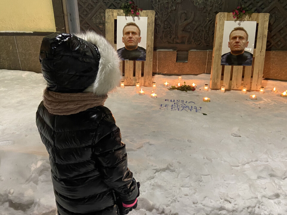 An ad-hoc Navalny memorial that was created outside Russia's consulate general in Kirkenes in February 2024 continues to receive candlelights.
