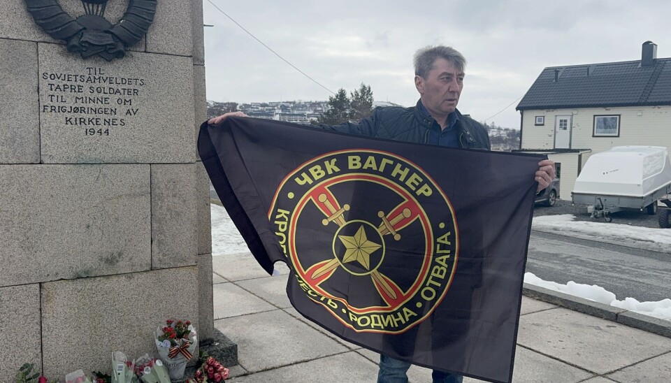 Sergei Korataev waived the flag of the Wagner Group and recorded video salutes for Russian warriors in front of the war memorial in Kirkenes, Norway.