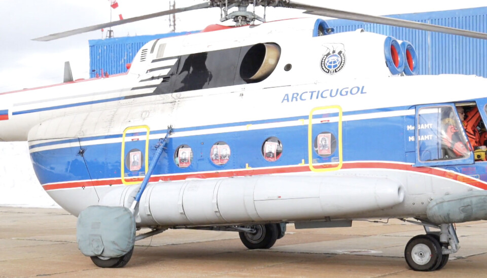 The Arktikugol operated Mi-8 helicopter had all windows in the passenger cabin covered by posters before take-off from the Russian aviation base at Kap Heer on Friday.