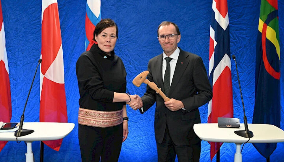 Espen Barth Eide (R) Minister of Foreign Affairs for Norway, hands the Arctic Council chairmanship to Vivian Motzfeldt, Minister of Foreign Affairs and Research for Greenland, representing the Kingdom of Denmark.