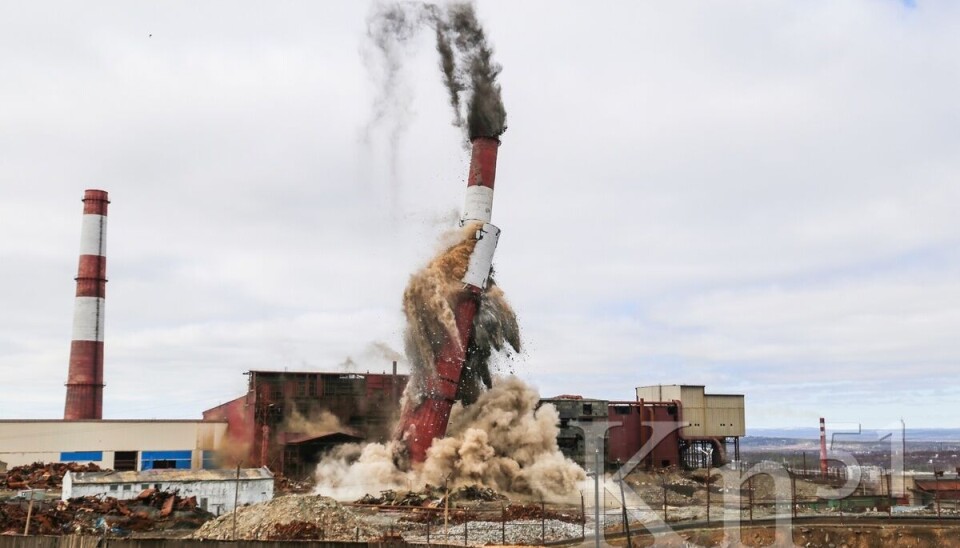 The 160-meter tall smokestack at the nickel-smelter in Russia's border town with Norway came down on May 15.