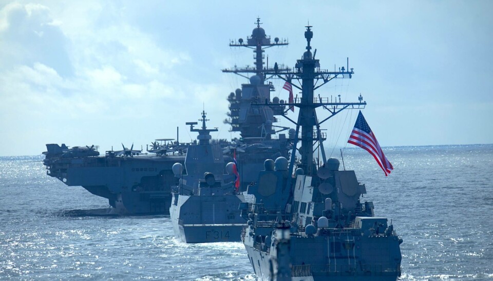 The U.S. aircraft carrier USS Gerald R. Ford followed by the Norwegian frigate Thor Heyerdal.