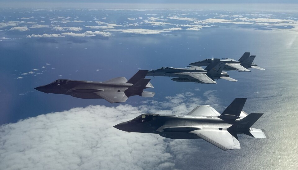 F/A-18 E/F Super Hornets attached to Carrier Air Wing 8 fly in formation with Royal Norwegian Air Force F-35 Lightning II aircraft off the western coast of Norway.