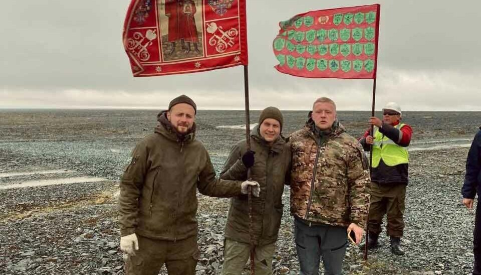 Andrei Afanasev and Boris Korchevnikov with imperial flags at Severnaya Zemlya.