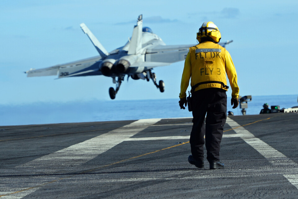 An F/A-18 fighter jet makes take-off from the aircraft carrier USS Gerald R. Ford sailing in the North Sea somewhere between Norway, the United Kingdom and Denmark.