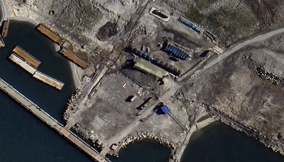 The blueish metal nets, known as 'cope cages' cover the three rows with fuel storage tanks close to the port facility at Severny. This satellite image is taken on August 14, 2025.