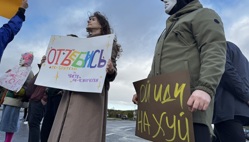 The inscription on the left poster reads: 'Fuck off - in a brotherly, purely human way.' The inscription on the left poster: 'Oh, fuck you'
