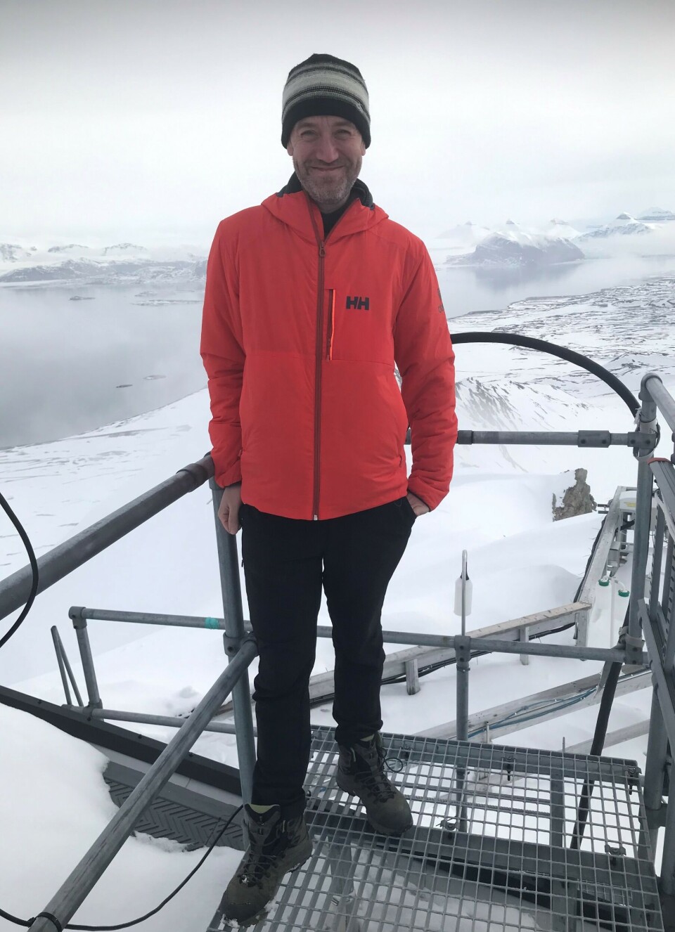Dr. Stephen Platt outside the Zeppelin observatory, where research on the levels of CO2 in the atmosphere is conducted